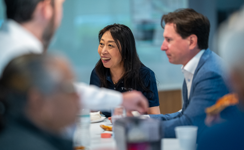 Yuko in conversation with TradeStation employees